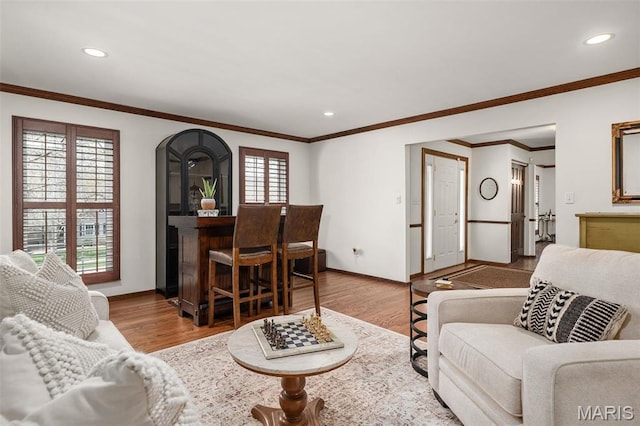 1578 Mason Knoll Rd, Town And Country, MO 63131 - living area featuring wood finished floors, baseboards, recessed lighting, crown molding, and arched walkways
