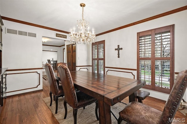 1578 Mason Knoll Rd, Town And Country, MO 63131 - dining space with a chandelier, wood finished floors, plenty of natural light, crown molding, and baseboards