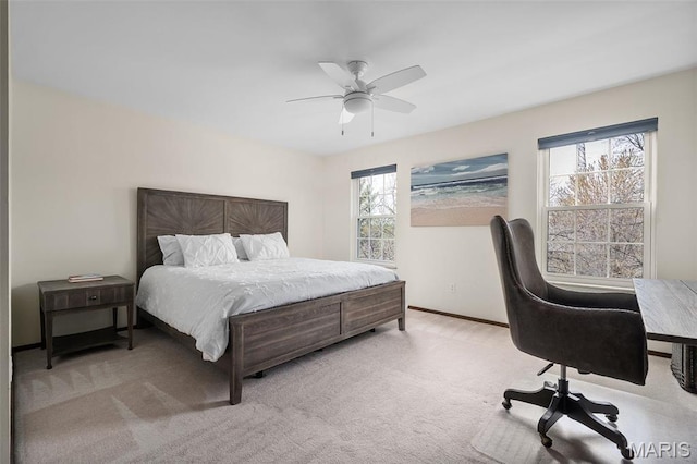 1578 Mason Knoll Rd, Town And Country, MO 63131 - carpeted bedroom featuring multiple windows, a ceiling fan, and baseboards