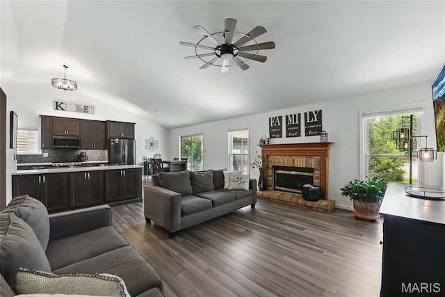 429 Arbor Meadow Ct, Ballwin, MO 63021 - living room featuring ceiling fan, lofted ceiling, healthy amount of natural light, a brick fireplace, and dark wood-type flooring