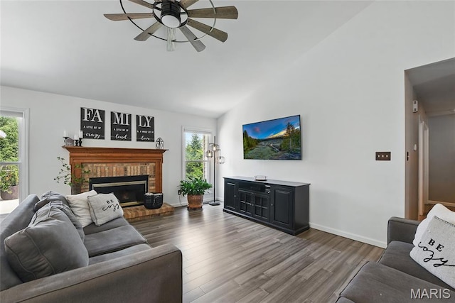 429 Arbor Meadow Ct, Ballwin, MO 63021 - living area with a ceiling fan, healthy amount of natural light, wood finished floors, high vaulted ceiling, and a fireplace