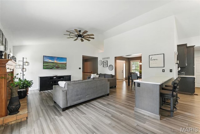 429 Arbor Meadow Ct, Ballwin, MO 63021 - living area featuring vaulted ceiling, light wood-type flooring, and a ceiling fan