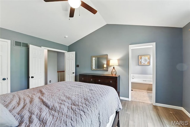 429 Arbor Meadow Ct, Ballwin, MO 63021 - bedroom with vaulted ceiling, wood finished floors, baseboards, ensuite bath, and ceiling fan