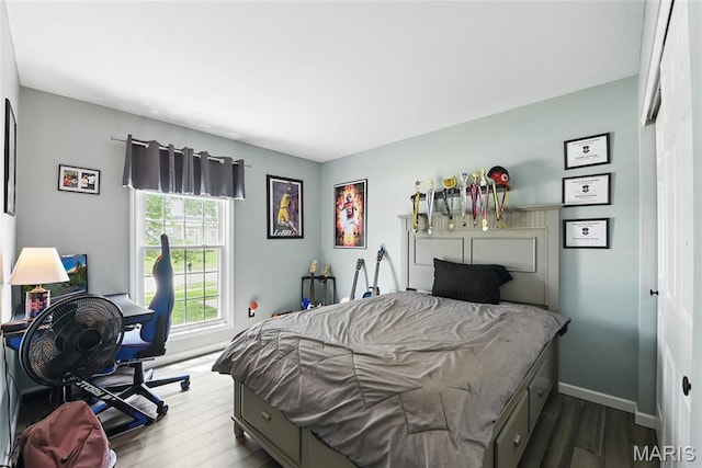 429 Arbor Meadow Ct, Ballwin, MO 63021 - bedroom with dark wood-style floors and baseboards