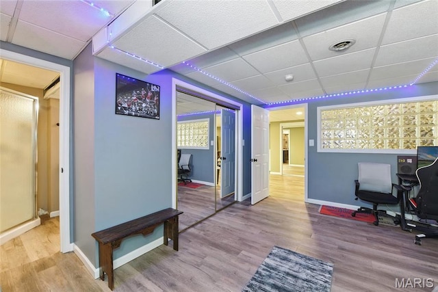 429 Arbor Meadow Ct, Ballwin, MO 63021 - home office featuring a drop ceiling, wood finished floors, and baseboards
