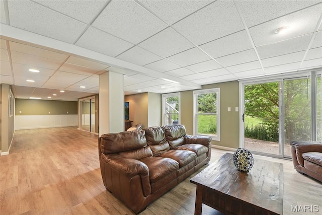 429 Arbor Meadow Ct, Ballwin, MO 63021 - living area with light wood-type flooring, a drop ceiling, and baseboards