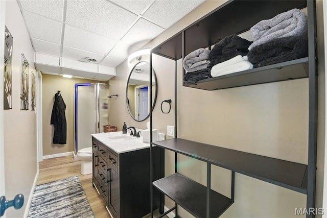 429 Arbor Meadow Ct, Ballwin, MO 63021 - full bath with wood finished floors, toilet, a paneled ceiling, vanity, and baseboards