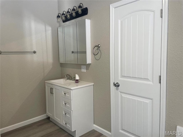 61 Wildwood Ter, Sullivan, MO 63080 - bathroom featuring vanity, wood finished floors, and baseboards