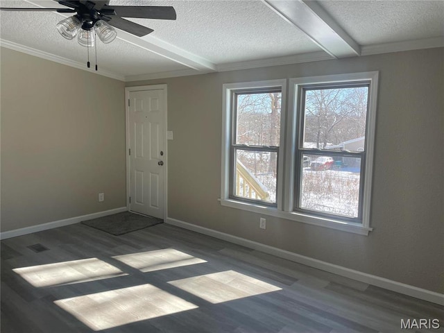 61 Wildwood Ter, Sullivan, MO 63080 - empty room featuring a textured ceiling, wood finished floors, a ceiling fan, baseboards, and beam ceiling