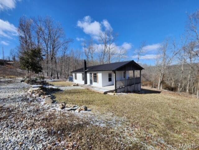 11498 M-Weatherman Dr, Mountain Grove, MO 65711 - view of side of property with a chimney and a yard