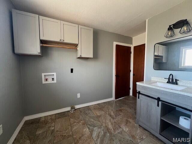 11498 M-Weatherman Dr, Mountain Grove, MO 65711 - washroom featuring hookup for a washing machine, baseboards, and cabinet space