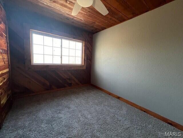 11498 M-Weatherman Dr, Mountain Grove, MO 65711 - carpeted spare room featuring wood ceiling, ceiling fan, and baseboards