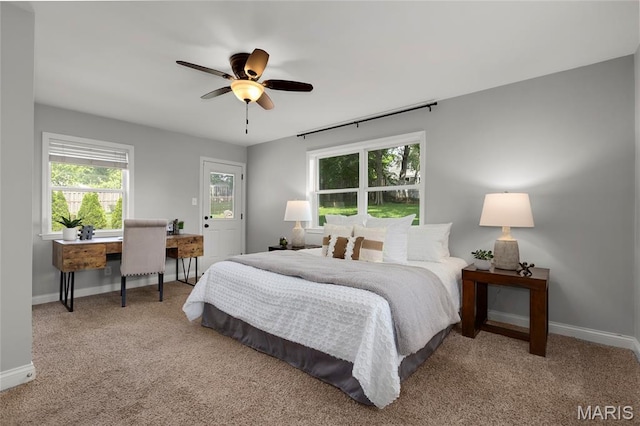 7603 Devonshire Ave, Shrewsbury, MO 63119 - carpeted bedroom with multiple windows, an office area, baseboards, and ceiling fan