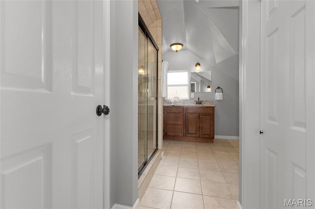 7603 Devonshire Ave, Shrewsbury, MO 63119 - full bath with vanity, a stall shower, tile patterned floors, and baseboards