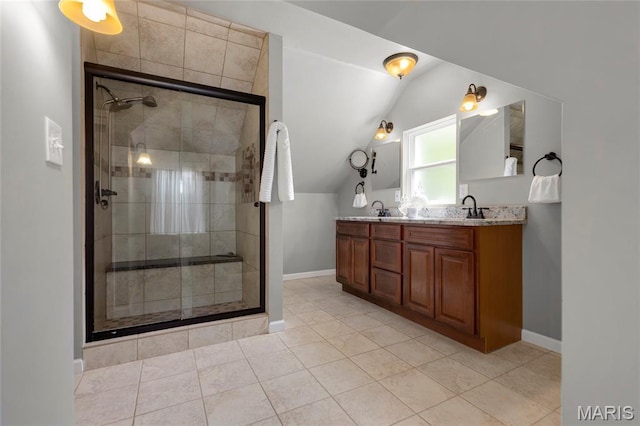 7603 Devonshire Ave, Shrewsbury, MO 63119 - bathroom with vaulted ceiling, double vanity, a stall shower, baseboards, and tile patterned flooring