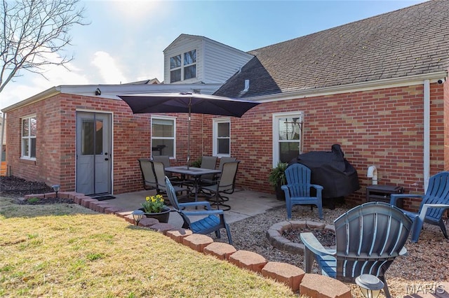7603 Devonshire Ave, Shrewsbury, MO 63119 - back of property with brick siding, a patio, a lawn, and a shingled roof