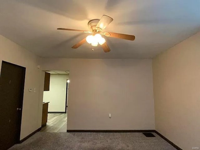 517 Mascoutah Ave, Belleville, IL 62220 - spare room with baseboards, a ceiling fan, and light colored carpet