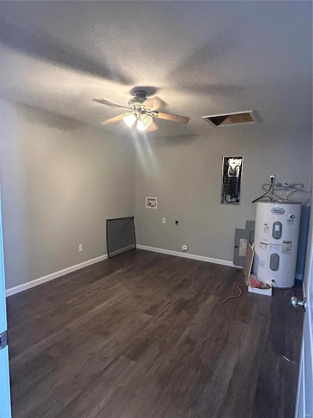 404 N Everett St, Kennett, MO 63857 - spare room featuring electric water heater, wood finished floors, ceiling fan, baseboards, and a textured ceiling
