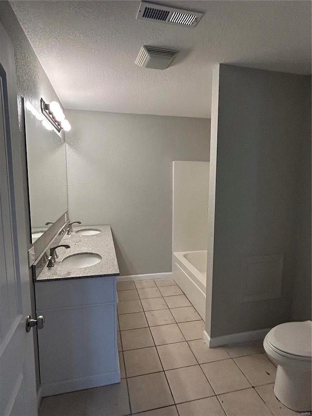404 N Everett St, Kennett, MO 63857 - bathroom with tile patterned flooring, toilet, a tub, a textured ceiling, and a shower