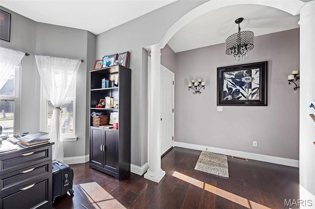 4028 Montague Cir Unit 4, Saint Charles, MO 63304 - entryway featuring decorative columns, arched walkways, and dark wood-style floors