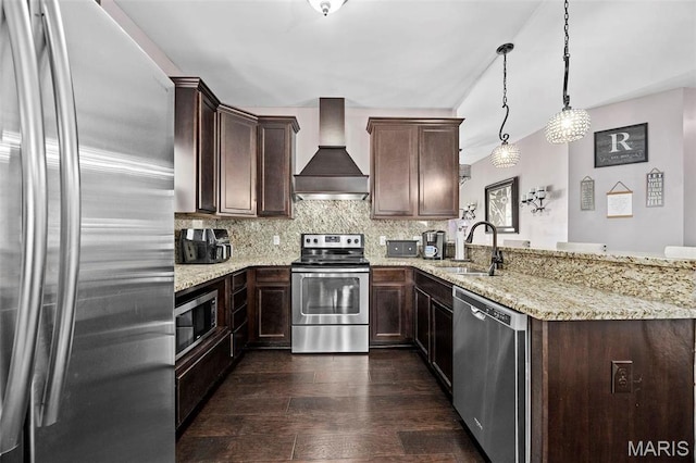 4028 Montague Cir Unit 4, Saint Charles, MO 63304 - kitchen with appliances with stainless steel finishes, a sink, wall chimney range hood, dark wood-style floors, and a peninsula