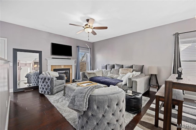 4028 Montague Cir Unit 4, Saint Charles, MO 63304 - living room with a ceiling fan, dark wood-type flooring, a glass covered fireplace, and baseboards