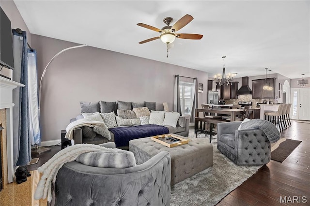 4028 Montague Cir Unit 4, Saint Charles, MO 63304 - living area featuring a chandelier, ceiling fan, a fireplace, dark wood-type flooring, and baseboards