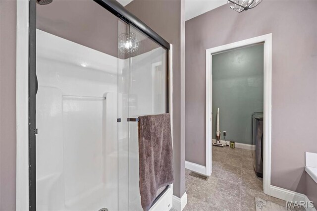 4028 Montague Cir Unit 4, Saint Charles, MO 63304 - full bath with a shower stall, baseboards, and tile patterned floors