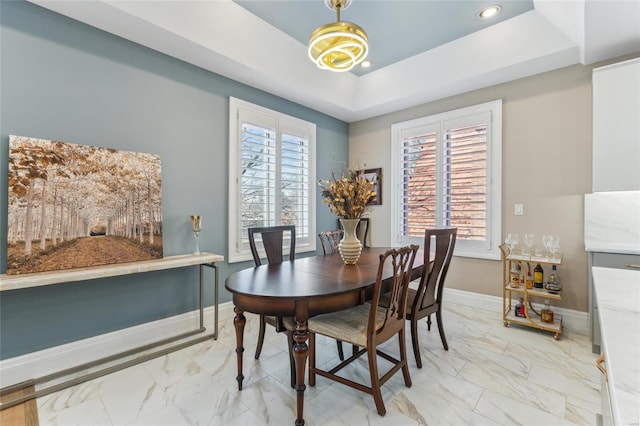 4411 Mcpherson Ave Unit 3, Saint Louis, MO 63108 - dining room with light marble finish floors, a raised ceiling, baseboards, and recessed lighting