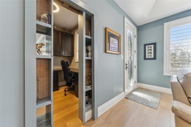 4411 Mcpherson Ave Unit 3, Saint Louis, MO 63108 - office area with light wood finished floors, baseboards, and built in study area