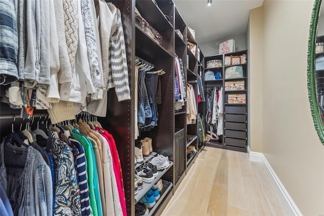 4411 Mcpherson Ave Unit 3, Saint Louis, MO 63108 - walk in closet featuring wood finished floors