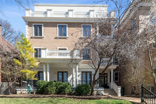 4411 Mcpherson Ave Unit 3, Saint Louis, MO 63108 - back of property featuring a balcony, french doors, and covered porch