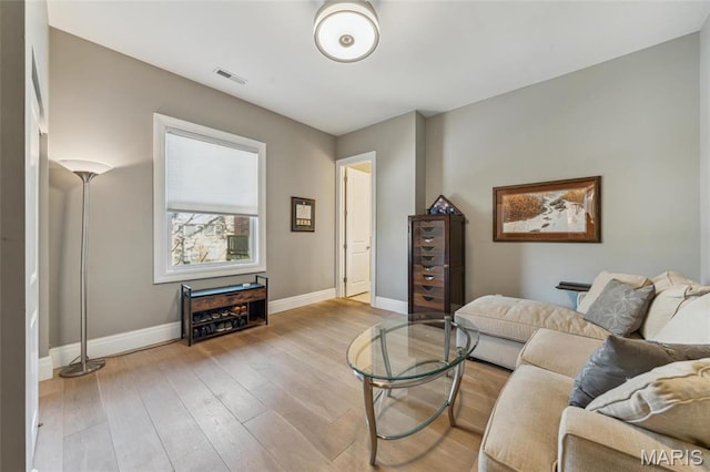 4411 Mcpherson Ave Unit 3, Saint Louis, MO 63108 - living room with wood-type flooring and baseboards