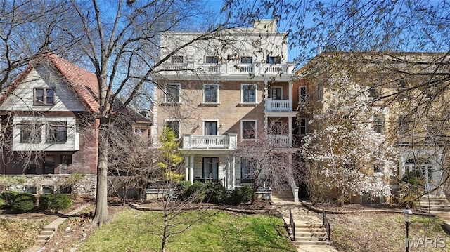4411 Mcpherson Ave Unit 3, Saint Louis, MO 63108 - view of front facade featuring a balcony and a chimney