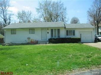 10219 Valley Dr, Saint Louis, MO 63137 - ranch-style house featuring a garage, driveway, and a front yard