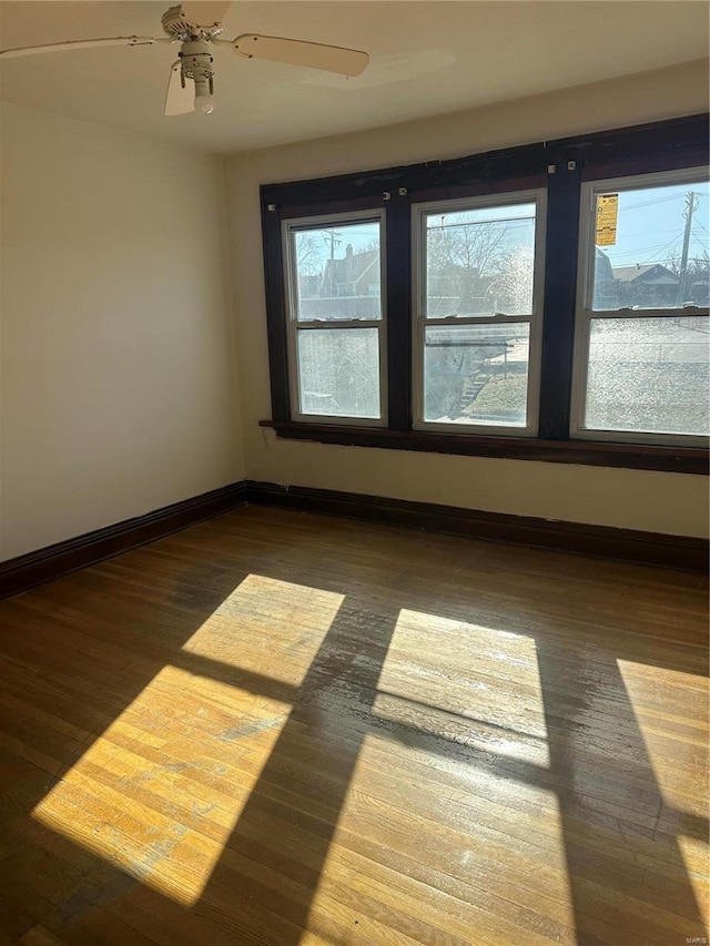 3923 Gravois Ave, Saint Louis, MO 63116 - spare room featuring baseboards, wood finished floors, and ceiling fan