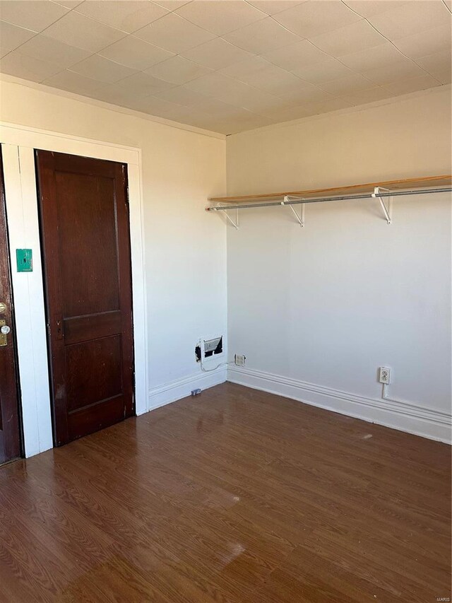 3923 Gravois Ave, Saint Louis, MO 63116 - clothes washing area featuring wood finished floors and baseboards