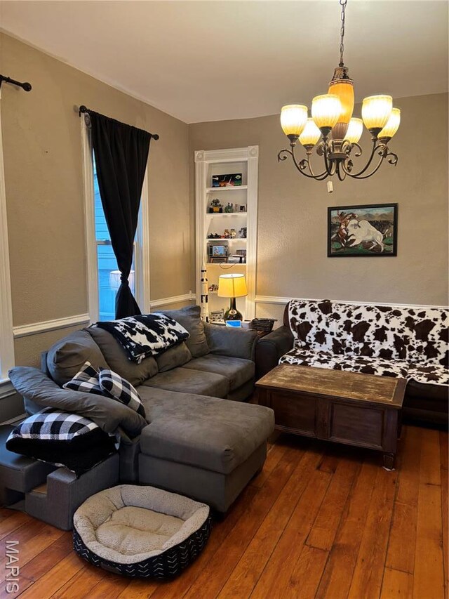 911 Grand Ave, Edwardsville, IL 62025 - living area with a chandelier, hardwood / wood-style flooring, and built in features