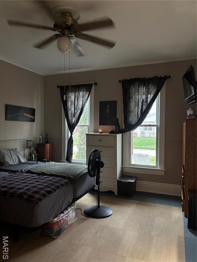 911 Grand Ave, Edwardsville, IL 62025 - bedroom with light colored carpet and a ceiling fan
