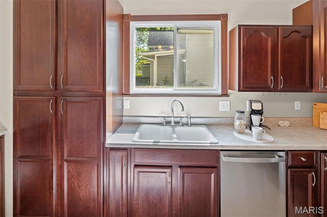 911 Grand Ave, Edwardsville, IL 62025 - kitchen featuring stainless steel dishwasher, a sink, and light countertops