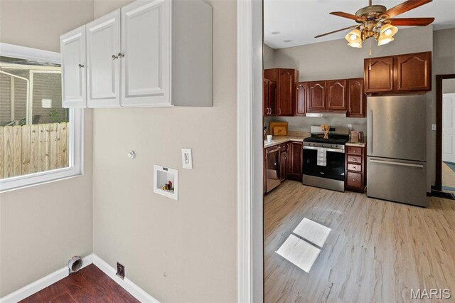 911 Grand Ave, Edwardsville, IL 62025 - washroom with a ceiling fan, gas dryer hookup, light wood-type flooring, and baseboards