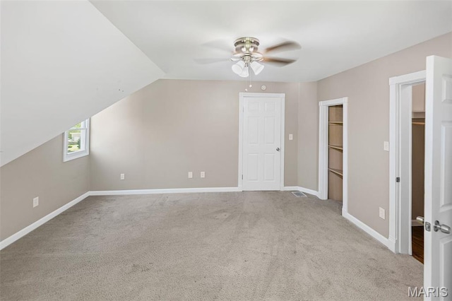 911 Grand Ave, Edwardsville, IL 62025 - additional living space featuring carpet, ceiling fan, baseboards, and vaulted ceiling