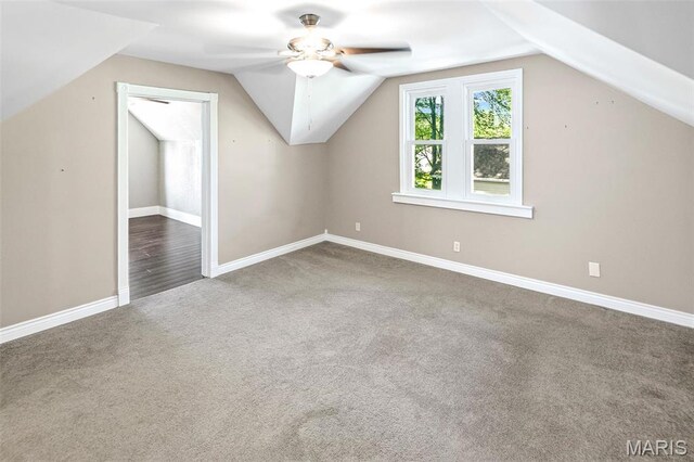 911 Grand Ave, Edwardsville, IL 62025 - additional living space with carpet floors, lofted ceiling, ceiling fan, and baseboards