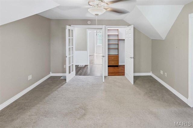 911 Grand Ave, Edwardsville, IL 62025 - additional living space featuring carpet floors, a ceiling fan, baseboards, and vaulted ceiling