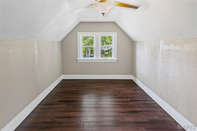 911 Grand Ave, Edwardsville, IL 62025 - additional living space featuring hardwood / wood-style floors, a ceiling fan, vaulted ceiling, and baseboards