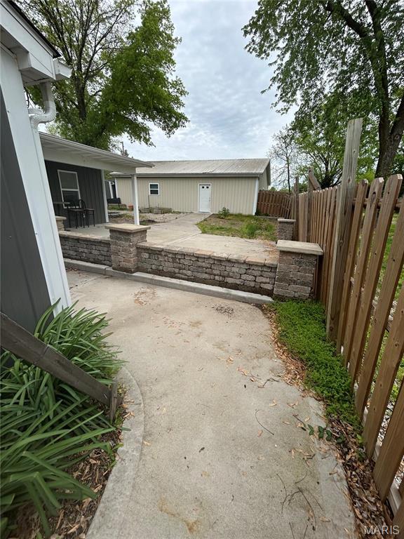 308 N Broadwater St, New Florence, MO 63363 - view of yard with a patio area and fence