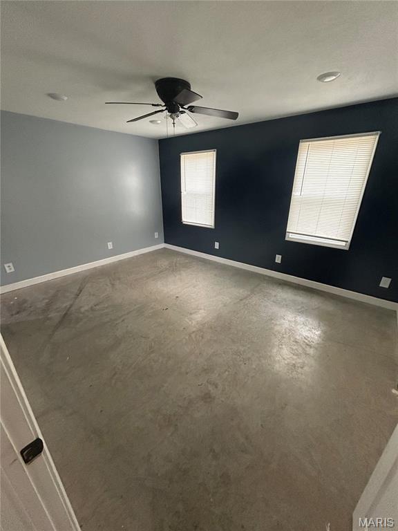 308 N Broadwater St, New Florence, MO 63363 - unfurnished room with ceiling fan, concrete floors, and baseboards