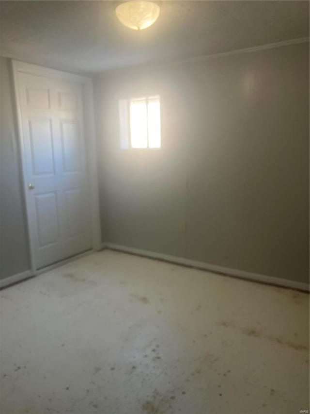 spare room featuring baseboards