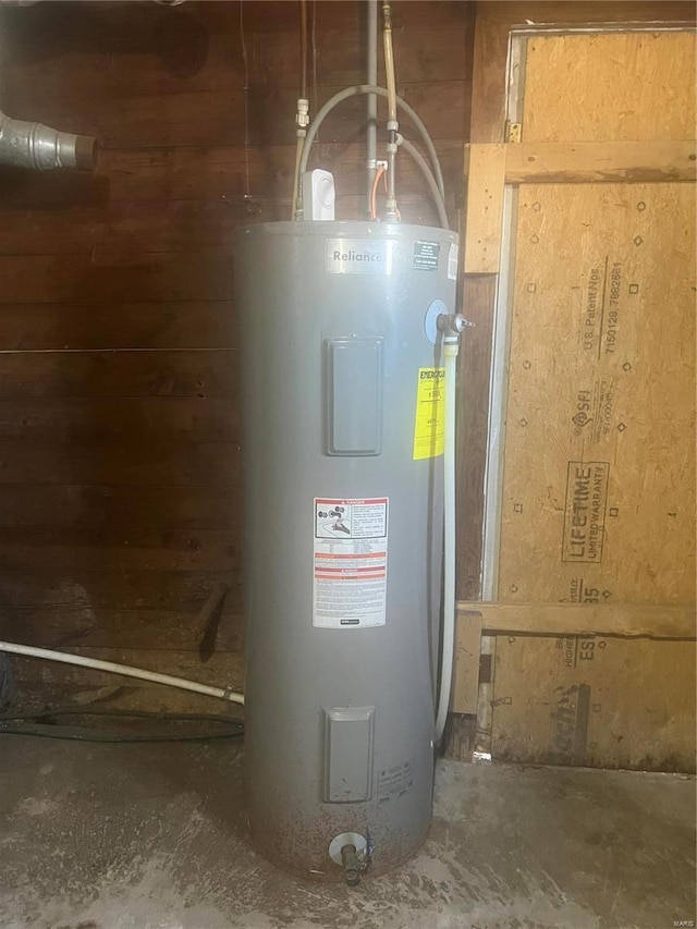 utility room featuring electric water heater