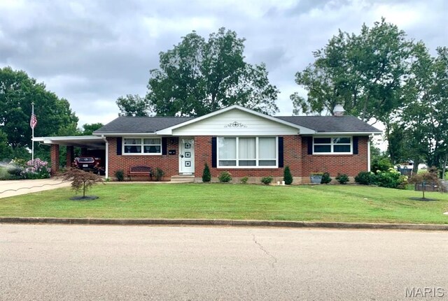 134 Pine St, Farmington, MO 63640 - ranch-style home with a carport, brick siding, a front lawn, and driveway